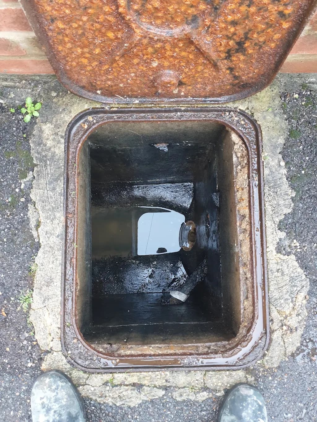 Inspection chamber cleared and running freely after a drain unblock
